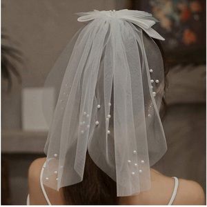 Bridal swimsuit or hair clip veil